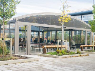 School dining room canopy with pupils eating inside