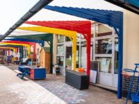 Rainbow coloured playground canopy