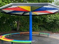 rainbow coloured umbrella playground shelter