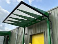 Large green loading bay canopy