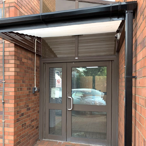 entrance canopy with guttering to keep people dry