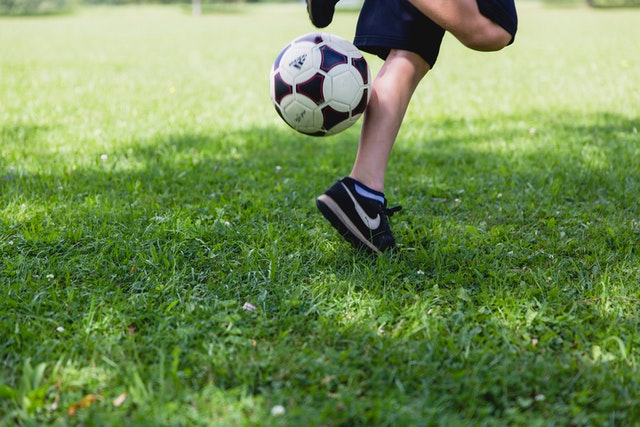 child playing football