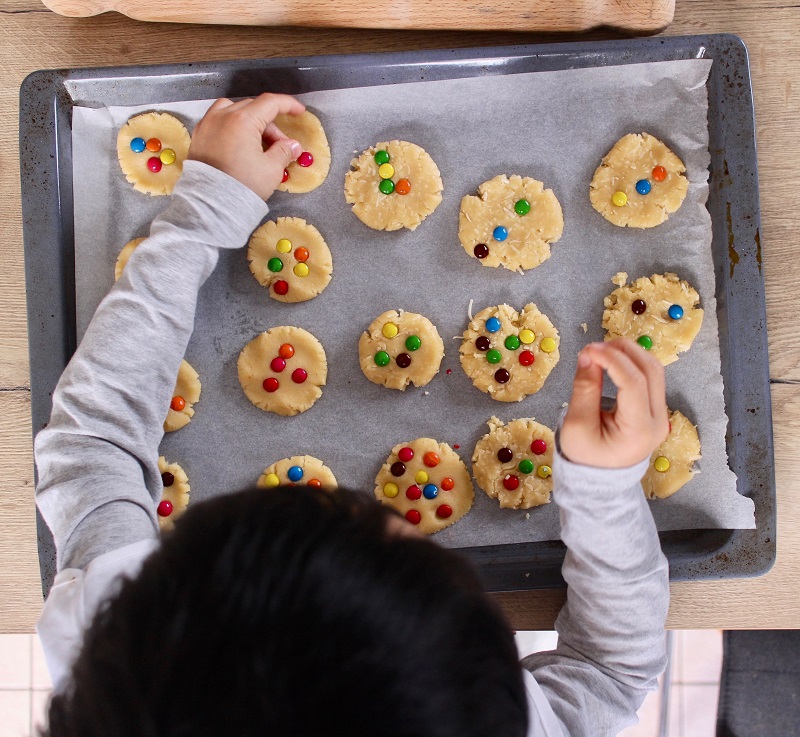 child baking biscuits